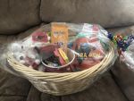 2 snuggly blankets<br />Cobra paw board game<br />Bingo game<br />Popcorn and popcorn container<br />Assorted candies<br />Coca Cola teddy bears<br />$25 Netflix gift card<br />$25 Blackjack Pizza gift card<br />Value $115